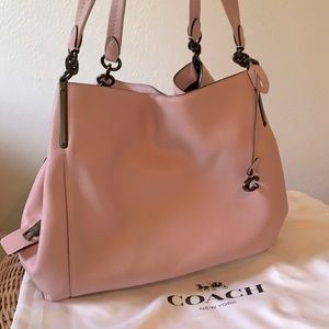 New Coach Handbag. Gorgeous blush color, never used. Soft leather.